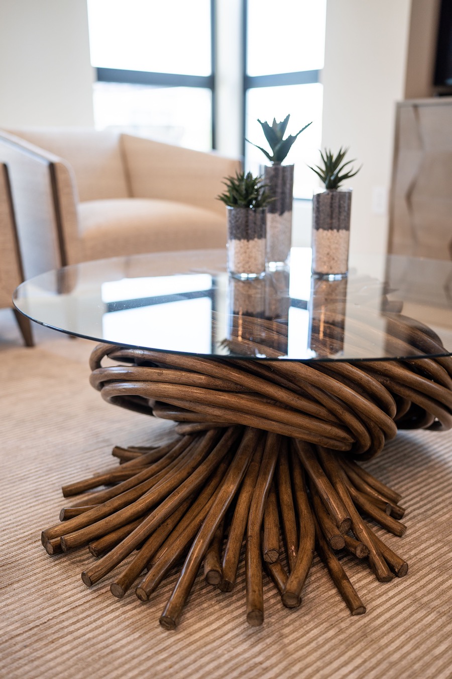 A table made of branches. Curved furniture fosters conversation and calming connections in biophilic designs.
