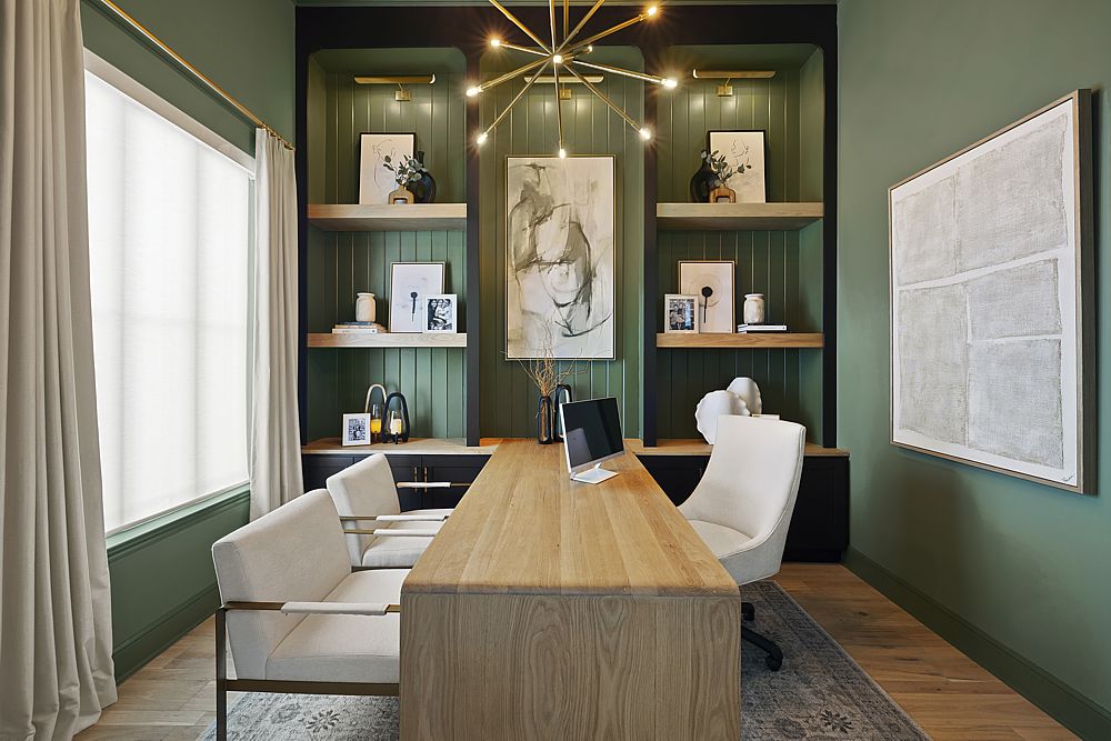 Luxury home office with custom built-in shelving and elegant lighting.